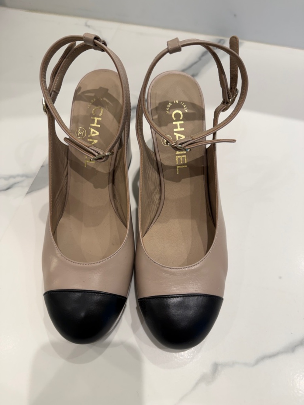CHANEL Beige and Black Cap-Toe Slingback Pumps
True fit 7 1.2